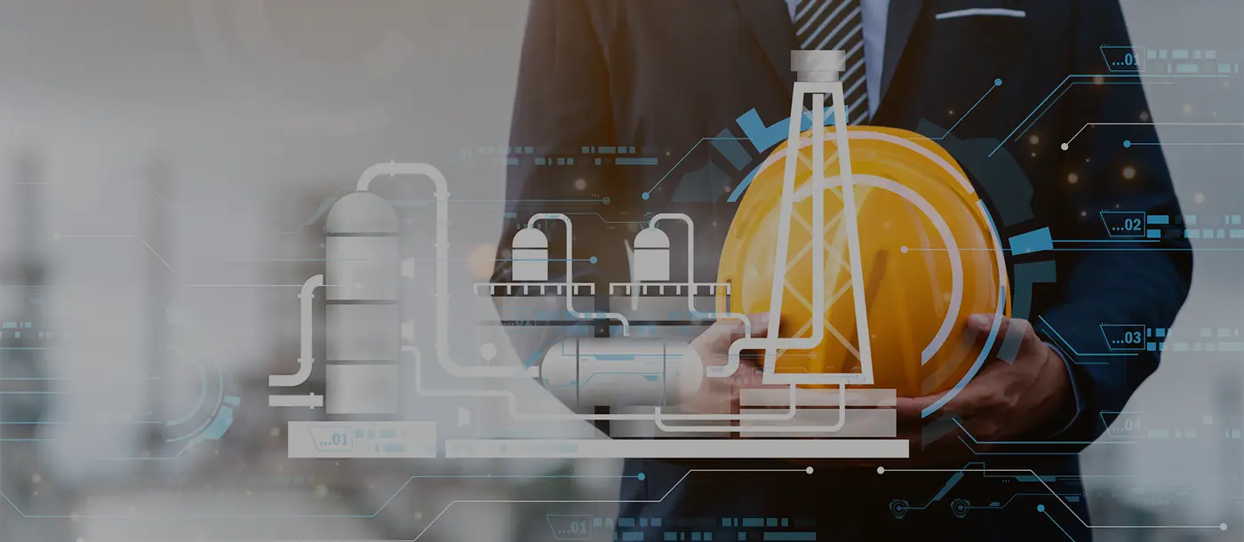 Engineer with hard hat and chemical plant schematic