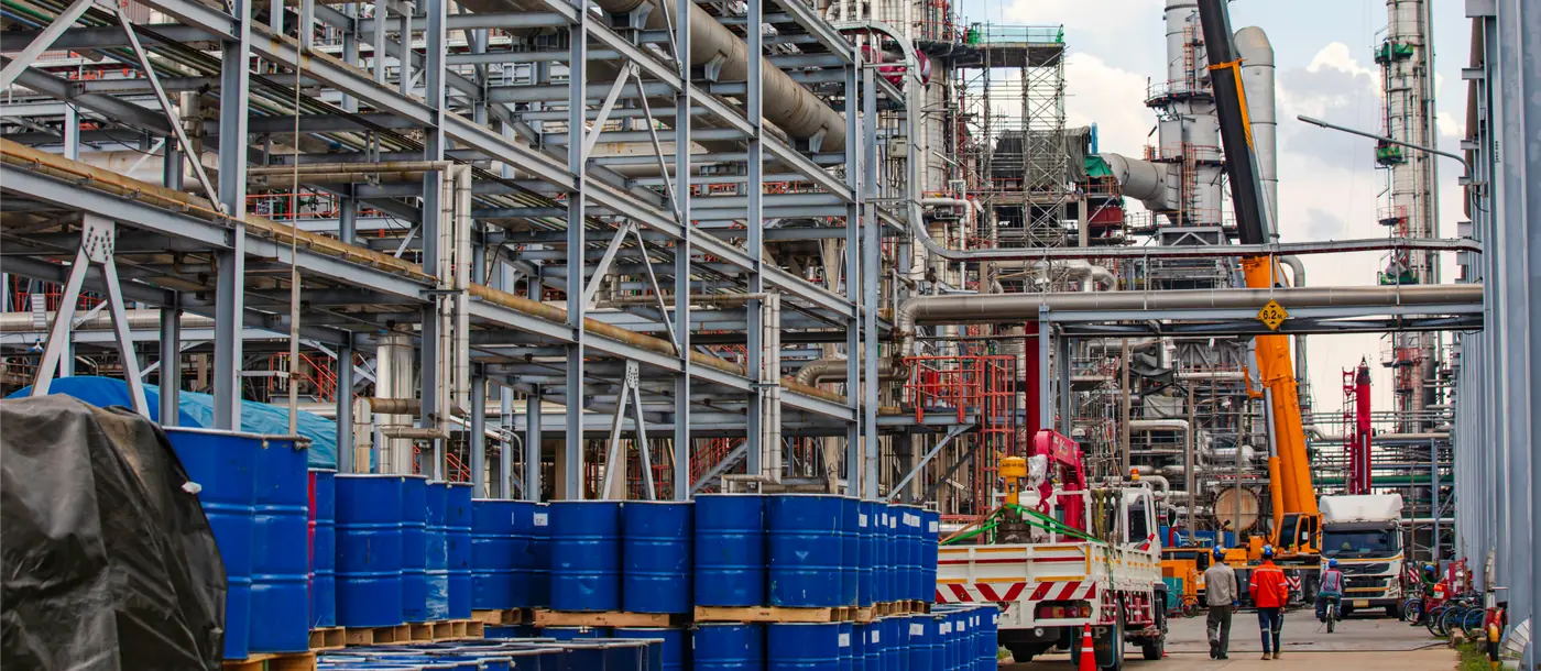 Chemical drums stored at an industrial processing plant