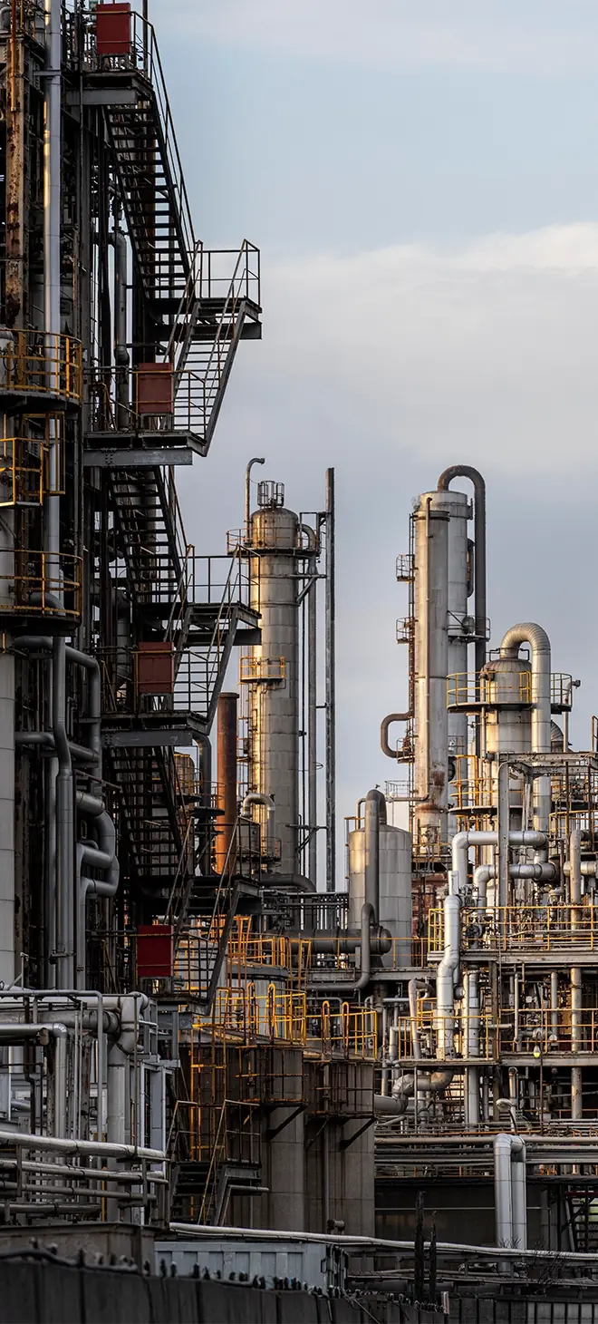 Chemical processing plant with distillation columns and pipework
