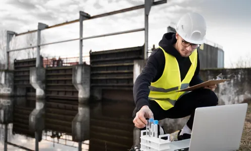 Technician testing water samples at a treatment plant